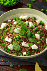Quinoa salad with green pea, mint, feta cheese and chilli flake. healthy diet food