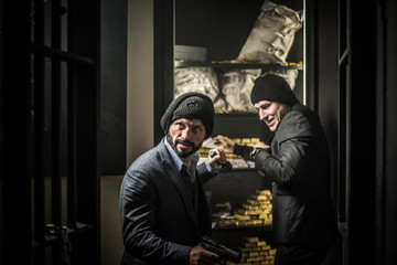 Two ardmed men robbing a bank