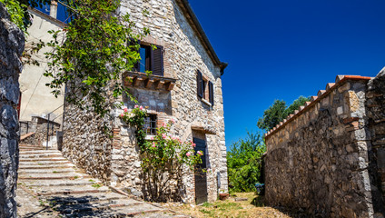 A characteristic glimpse of the city of Amelia, in Umbria. The cobbled alley, the stairs, the stone...