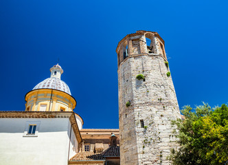 The dome of the cathedral of the city of Amelia with the dodecagonal tower, in Umbria. The crucifix...