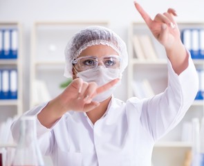 Female scientist researcher conducting an experiment in a labora