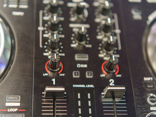 Photography of the modern premium dj remote. Design of professional musical equipment. Close frontal view.