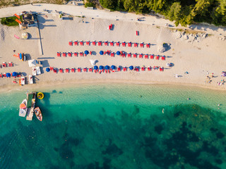 Aerial drone photo of natural beauty bay and sandy beach of Valtos with watersports facilities and emerald sea. Parga, Epirus