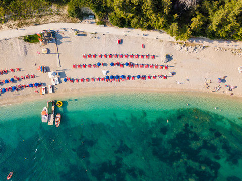 Aerial drone photo of natural beauty bay and sandy beach of Valtos with watersports facilities and emerald sea. Parga, Epirus