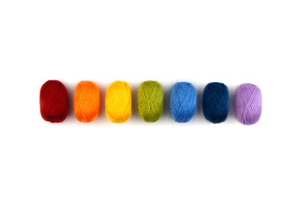 Colorful balls of wool in a row. Closeup.