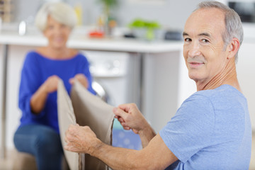 Fototapeta premium senior couple after washing cloths