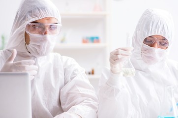 Two chemists working in the lab