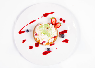 Tartlet with cream decorated with berry fruit