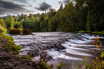 Fototapeta na wymiar Very small waterfalls at Abavas Rumba, Latvia.