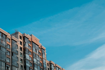 Premium house with sunlit facade and blue sky