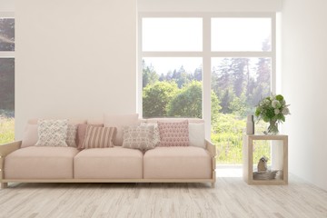 Fototapeta premium Stylish room in white color with sofa and summer landscape in window. Scandinavian interior design. 3D illustration