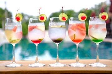 glasses of cocktails on pool bar
