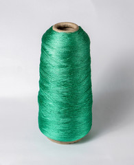 bobbin of yarn on a white background. Side view.Textile reel on isolated white background.