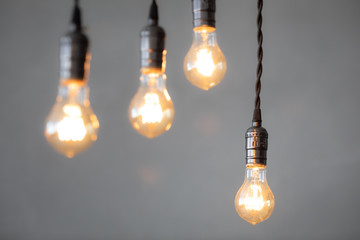 Idea concept - light bulbs against grey background