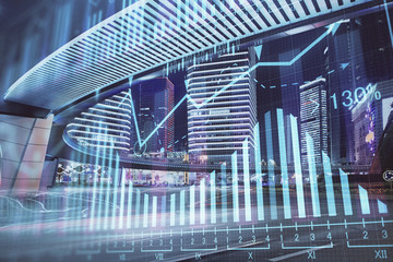 Forex chart on cityscape with tall buildings background multi exposure. Financial research concept.