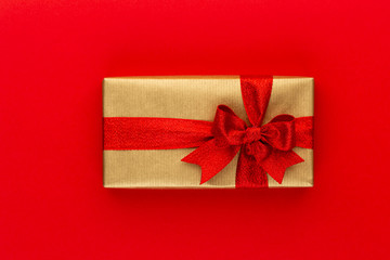 Christmas gift boxes with ribbons on color tabletop.