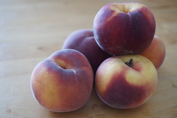 Fototapeta na wymiar peaches on wooden table
