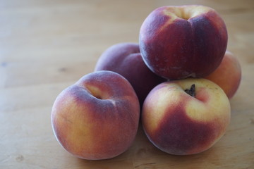 peaches on wooden table