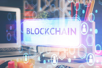 Crypto theme hologram with glasses on the table background. Concept of blockchain. Double exposure.