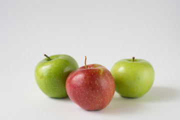 red and green apples with slices and leaves isolated on white background top view. Set or collection. Flat lay pattern