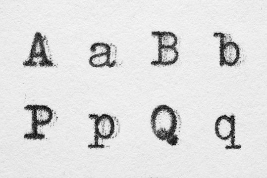 Real typewriter font alphabet with letters A, B, P, Q