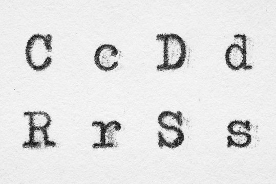 Real typewriter font alphabet with letters C, D, R, S
