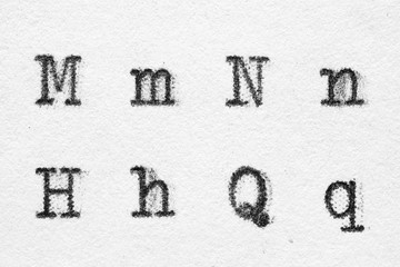 Real typewriter font alphabet with letters M, N, H, Q