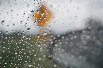 Rain drops on car glass, selective focused
