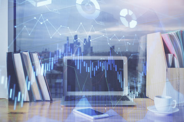 Stock market graph and table with computer background. Multi exposure. Concept of financial analysis.
