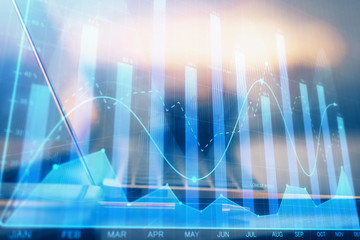 Forex graph hologram on table with computer background. Multi exposure. Concept of financial markets.