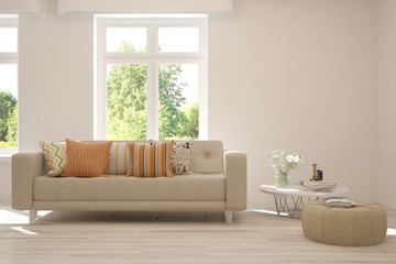 Obraz premium Stylish room in white color with sofa and summer landscape in window. Scandinavian interior design. 3D illustration
