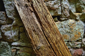 Old rotten wood texture with sand stone background. Old damaged background texture with dirt and scratches. Old wooden texture close up. Abstract background.