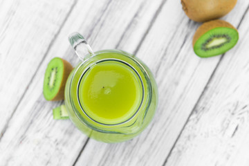 Vintage wooden table with fresh made Kiwi Smoothies
