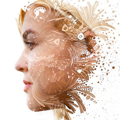 Paintography. Double exposure profile of a young natural beauty, with face and hair combined with hand drawn leaves and flowers dissolving into the background