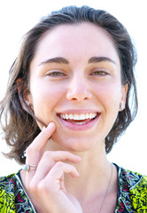 Portrait of a young girl with short hair and flawless skin. looking into the camera and smiling