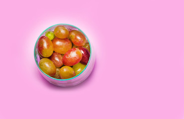 Glass with grape on a blue background. copy space