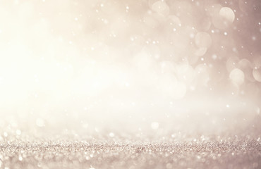 Glitter vintage lights abstract background new year holiday. Silver and white, copy space.