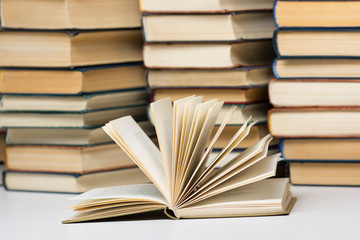 Open book, hardback books on wooden table. Back to school. Copy space