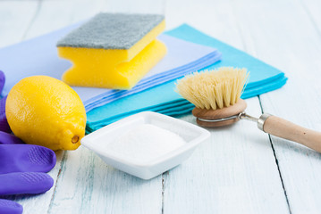 dishwashing tools and citric acid, lemon on white wooden