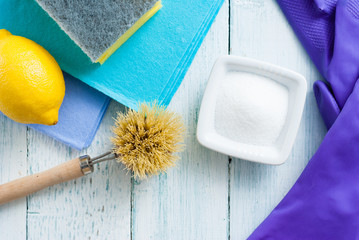 dishwashing tools and citric acid, lemon on white wooden