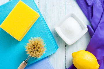 dishwashing tools and citric acid, lemon on white wooden