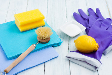 dishwashing tools and citric acid, lemon on white wooden
