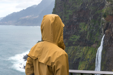 Woman looking at Bridal Veil Falls veu da noiva in Madeira, Portugal