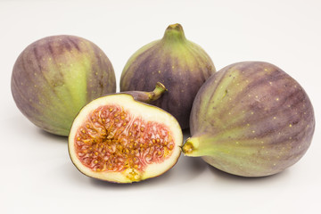 group of whole and halved fresh figs
