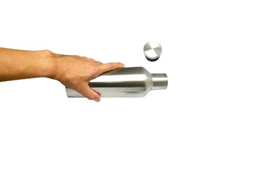 adult hand holding a stainless bottle with open cover on white background isolated