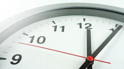 Gray wall clock face beginning of time 12.06 am or pm on White background, Copy space for your text, Time concept..