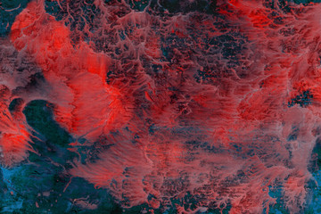 abstract red nebula painted with acrylic on canvas on blue background with spots