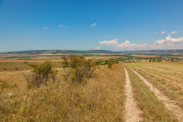 Road through the southern grasses on the hill