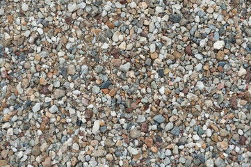 Close-up of multicolored pebbles for use in wallpaper, texture, design, pattern and backgrounds. Horizontal shot.