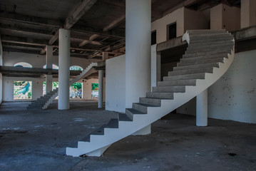 Unfinished, abandoned and empty white building, urbex 